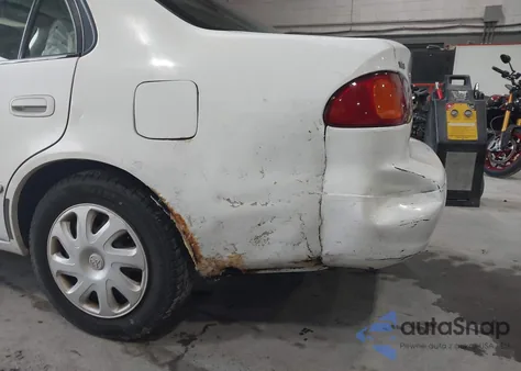 2001 Toyota Corolla Le z USA, uszkodzony, nr VIN 2T1BR12E11C473152